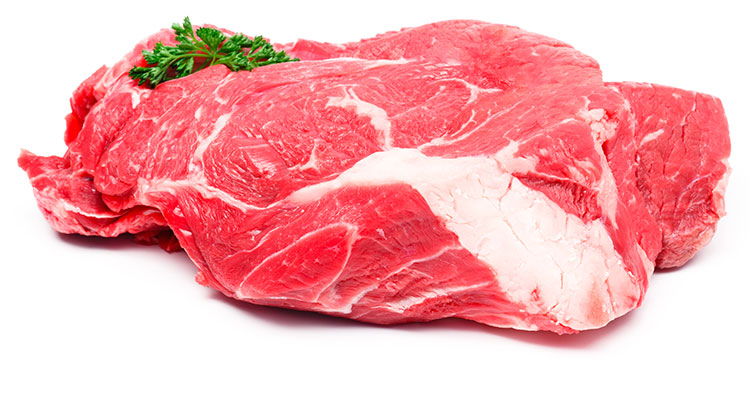 A huge slab of a beef round, with a spring of parsley on top